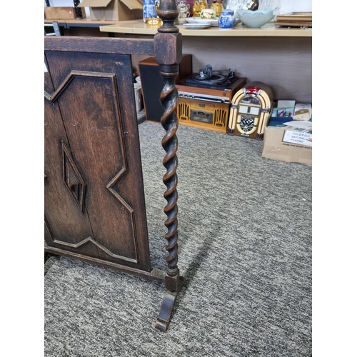 404 - Good quality antique dark oak fire screen with a diamond shape to the centre, has good carving throu... 