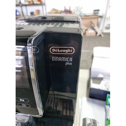 391 - A Delonghi Dinamica Plus coffee machine in good order, includes operation manual and a sealed bag of... 