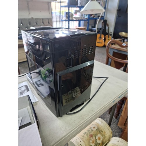 391 - A Delonghi Dinamica Plus coffee machine in good order, includes operation manual and a sealed bag of... 