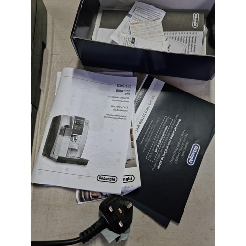 391 - A Delonghi Dinamica Plus coffee machine in good order, includes operation manual and a sealed bag of... 