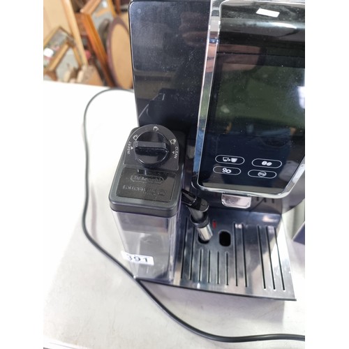 391 - A Delonghi Dinamica Plus coffee machine in good order, includes operation manual and a sealed bag of... 