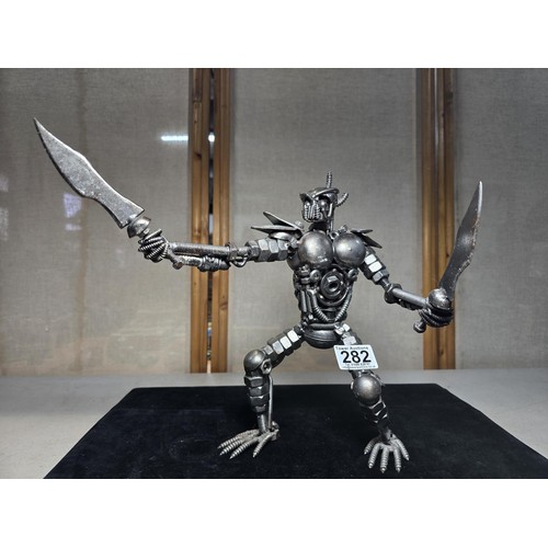 282 - A handmade very impressive metal art sculpture (29cm high) completely made from nuts and bolts spark... 