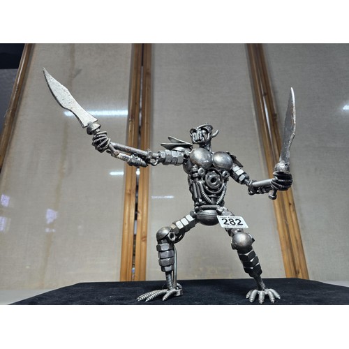 282 - A handmade very impressive metal art sculpture (29cm high) completely made from nuts and bolts spark... 