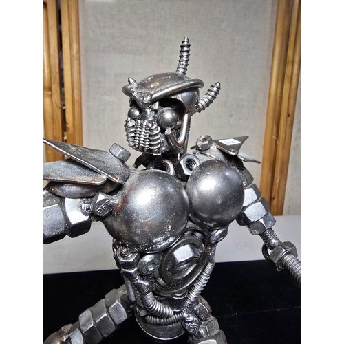 282 - A handmade very impressive metal art sculpture (29cm high) completely made from nuts and bolts spark... 