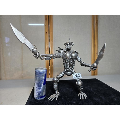 282 - A handmade very impressive metal art sculpture (29cm high) completely made from nuts and bolts spark... 