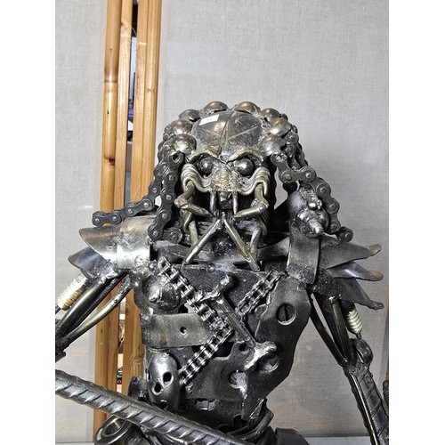 283 - A large and impressive handmade metal art sculpture of The Predator (49cm high) completely made from... 