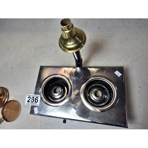 286 - A miniature metal operational stove featuring a copper kettle and a copper frying pan an 2 burners o... 