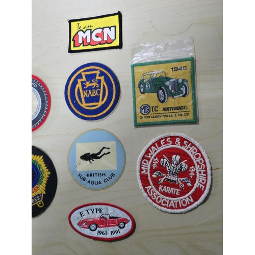 271 - A quantity of 10x sew on patches along with 2 others mostly relating to cars and bikes which include... 