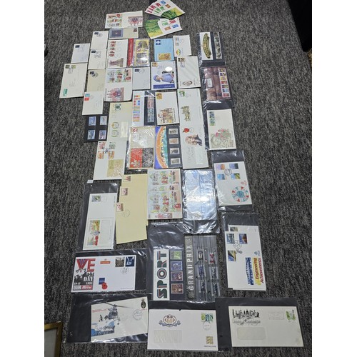 273 - A comprehensive collection of various first day covers and themed Royal Mail mint stamp sets which i... 