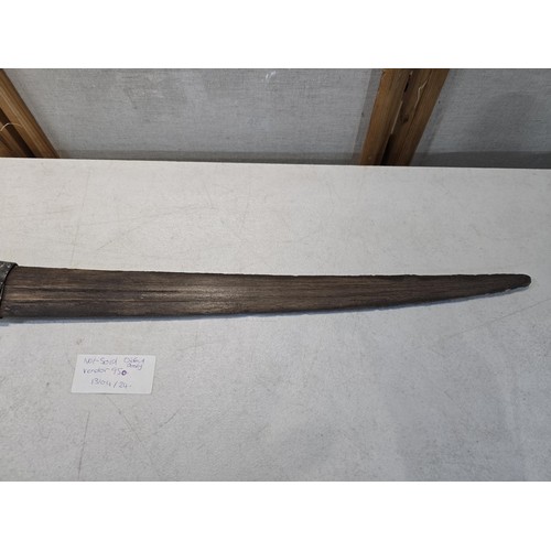 277 - An impressive antique swordfish bill blade with an antique hammered metal collar and string made han... 