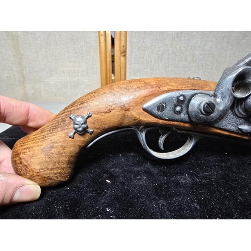 290 - A pair of replica 18th century pirates flintlock pistols made out of solid wood with a zinc metal ba... 