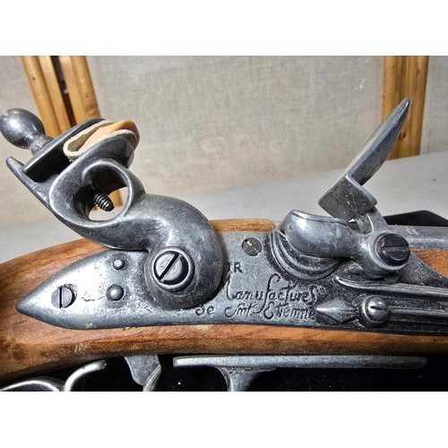 290 - A pair of replica 18th century pirates flintlock pistols made out of solid wood with a zinc metal ba... 