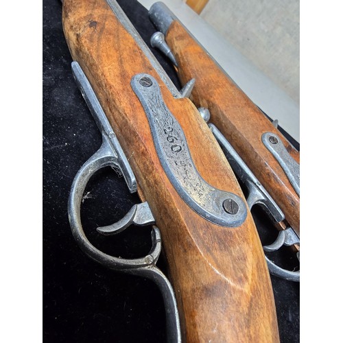 290 - A pair of replica 18th century pirates flintlock pistols made out of solid wood with a zinc metal ba... 