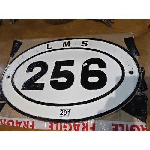 291 - an original cast iron LMS railway ridge plate no.256 with traditional white background with black pa... 