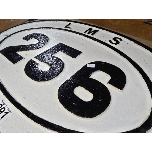 291 - an original cast iron LMS railway ridge plate no.256 with traditional white background with black pa... 