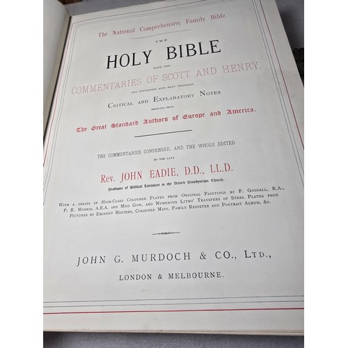 294 - A large antique family holy bible with a black leather hard cover featuring gilt and ornate corners ... 