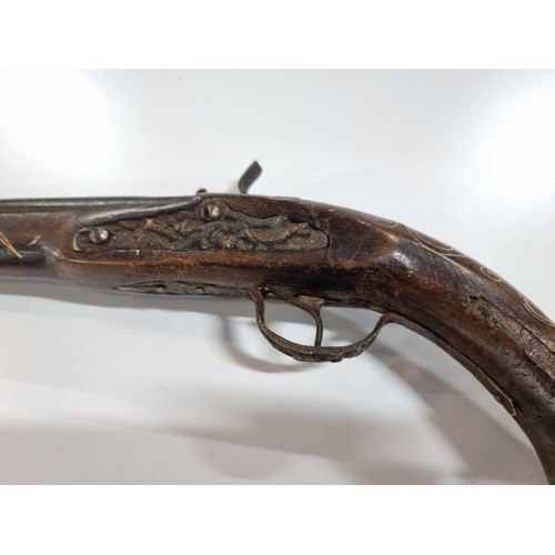 302 - Pair of replica 18th century flint lock, the pistols are made from wood with an iron barrel and hamm... 