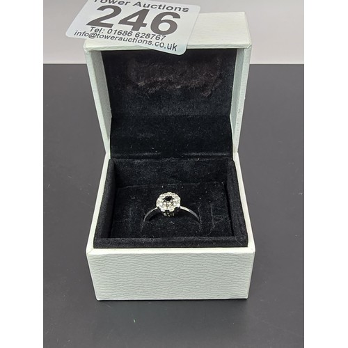 225 - A pretty as new 925 silver cluster ring inset with very sparkly clear CZ crystal stones with a black... 