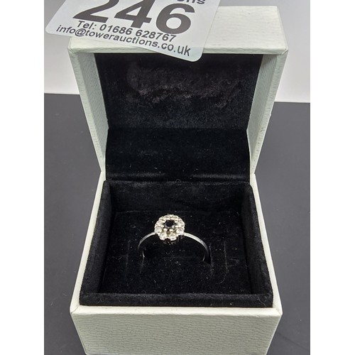 225 - A pretty as new 925 silver cluster ring inset with very sparkly clear CZ crystal stones with a black... 