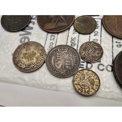 168 - A quantity of collectable coins to include 4 silver coins, to include an 1887 Queen Victoria 6 pence... 