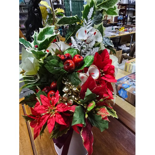 20 - Beautifully arranged spray of Christmas theme artificial flowers featuring s ball and stick with orn... 