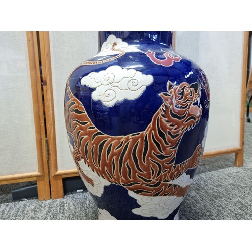 7 - A very large and impressive Chinese floor standing vase with a very colourful dragon design, in very... 