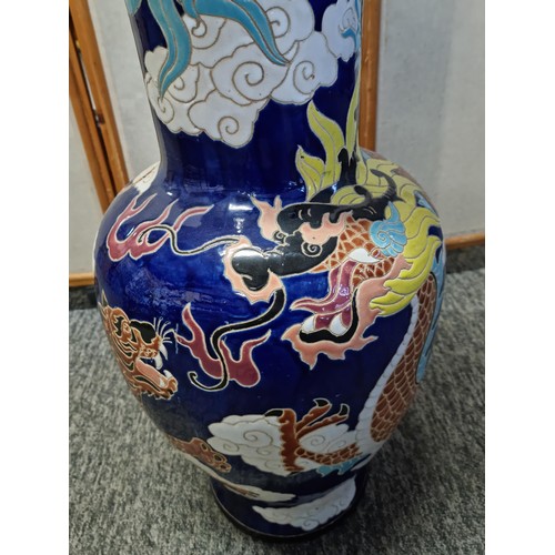 7 - A very large and impressive Chinese floor standing vase with a very colourful dragon design, in very... 