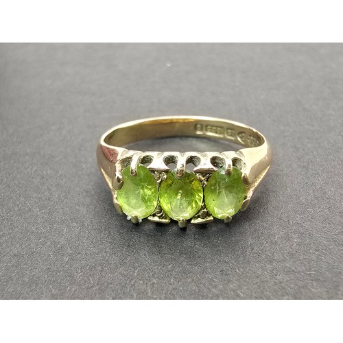 253 - A stunning antique hallmarked 15ct yellow gold peridot 3 stone ring, inset with 3 large faceted peri... 