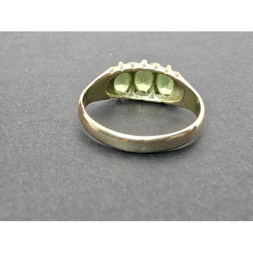 253 - A stunning antique hallmarked 15ct yellow gold peridot 3 stone ring, inset with 3 large faceted peri... 