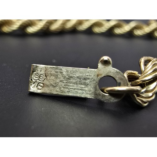 252 - A good quality chunky hallmarked 9ct yellow gold rope twist neck chain, having a total length of 20