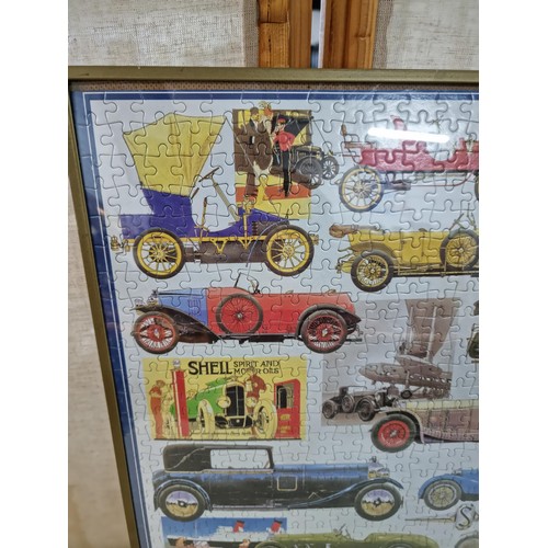 25 - Framed and glazed completed jigsaw depicting antique and vintage cars in good order frame measures 5... 