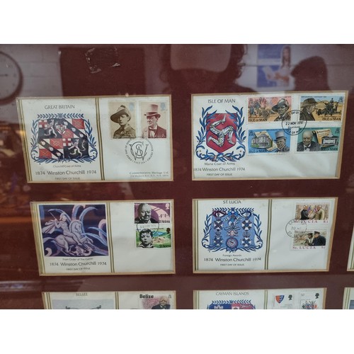 28 - Large framed and glazed set of First Edition First Day covers of the Winston Churchill stamp set con... 