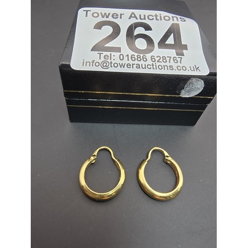 264 - A pair of small 18ct yellow gold hoop earrings with a chunky design, the earrings are in good condit... 