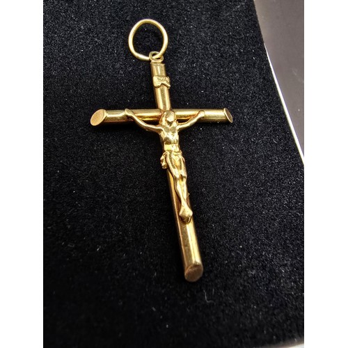 266 - A good 9ct yellow gold large crucifix pendant which is well cast, presenting good detail, length of ... 