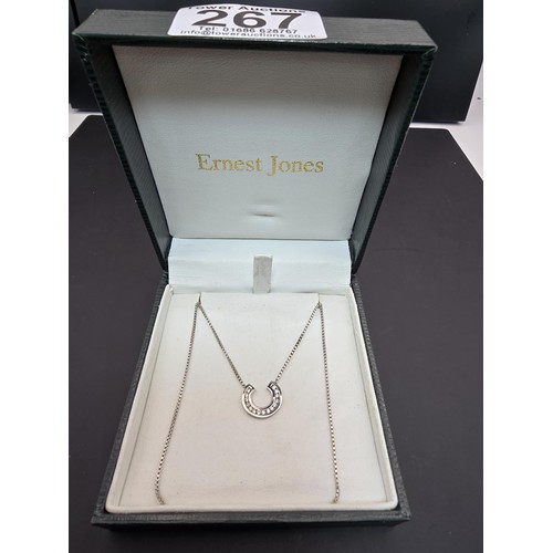 267 - A pretty as new hallmarked 9ct white gold necklace featuring a horseshoe pendant inset with sparkly ... 