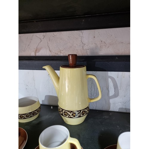 44 - Good quality yellow and brown Carlton ware coffee set inc coffee pot with lid, 6 cups and saucers, m... 