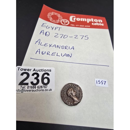 236 - An interesting ancient coin which appears to be an Egyptian AD 270-275 coin depicting Alexandria Aur... 