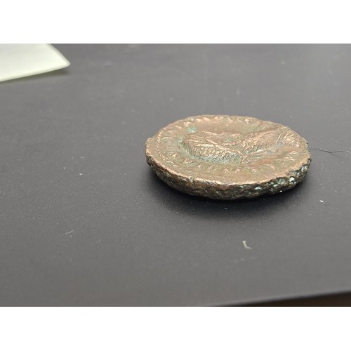 236 - An interesting ancient coin which appears to be an Egyptian AD 270-275 coin depicting Alexandria Aur... 