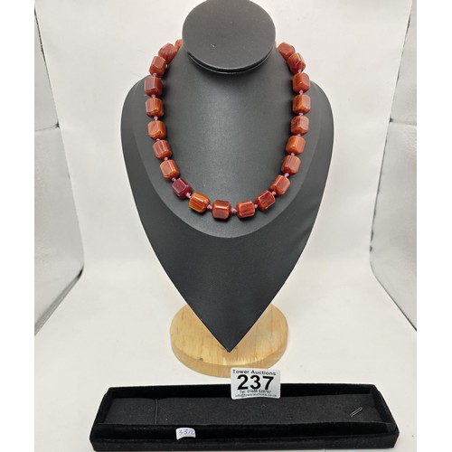 237 - A stunning vintage Bakelite beaded hand knotted necklace featuring shaped cubed beads, the Bakelite ... 