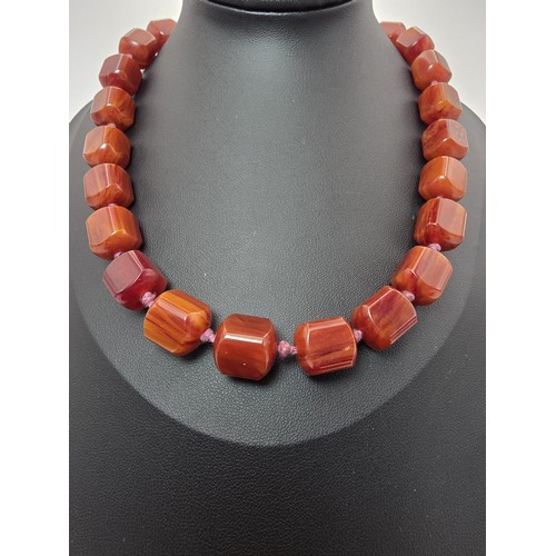 237 - A stunning vintage Bakelite beaded hand knotted necklace featuring shaped cubed beads, the Bakelite ... 