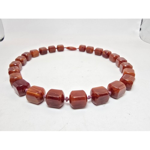 237 - A stunning vintage Bakelite beaded hand knotted necklace featuring shaped cubed beads, the Bakelite ... 