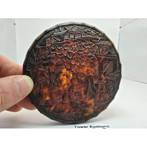 239 - A fine quality antique Chinese deep carved tortoise shell lidded pot, the round pot has a deep carve... 