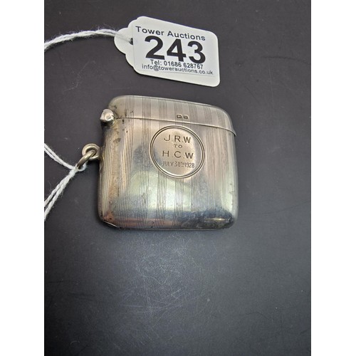 243 - A good quality heavy hallmarked silver Vesta case having an engraved striped design, featuring a str... 