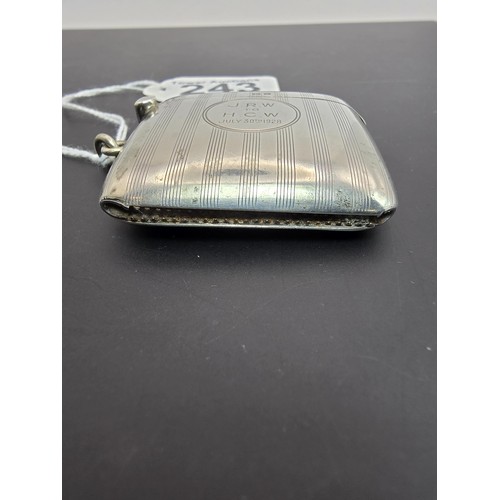 243 - A good quality heavy hallmarked silver Vesta case having an engraved striped design, featuring a str... 