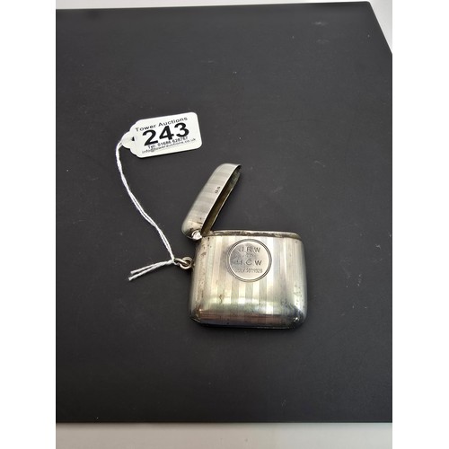 243 - A good quality heavy hallmarked silver Vesta case having an engraved striped design, featuring a str... 