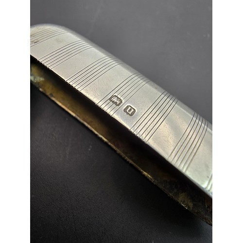 243 - A good quality heavy hallmarked silver Vesta case having an engraved striped design, featuring a str... 