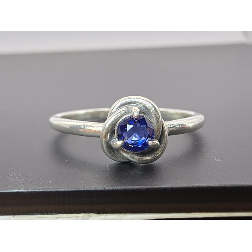 179 - An as new genuine Pandora 925 silver ring inset with a blue crystal stone, the ring is marked S925 A... 