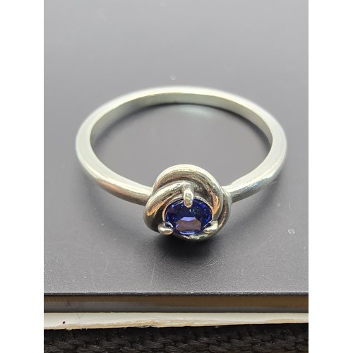 179 - An as new genuine Pandora 925 silver ring inset with a blue crystal stone, the ring is marked S925 A... 