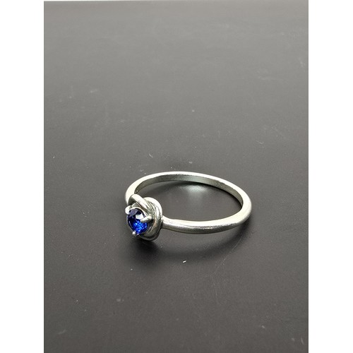 179 - An as new genuine Pandora 925 silver ring inset with a blue crystal stone, the ring is marked S925 A... 