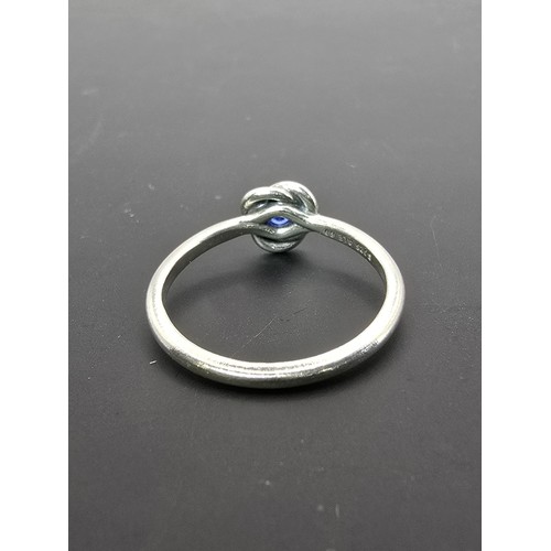 179 - An as new genuine Pandora 925 silver ring inset with a blue crystal stone, the ring is marked S925 A... 